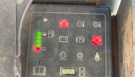 skid steer warning lights meaning